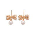 Crystal Bow Pearl Drop Stud Earrings In Gold And Silver view 5