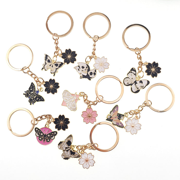 Gold Tone Butterfly Skull and Sakura Flower Clip Keychains