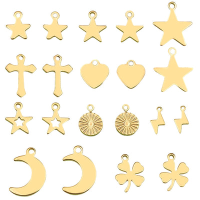 Gold-tone heart and four-leaf clover charms arranged on a light background