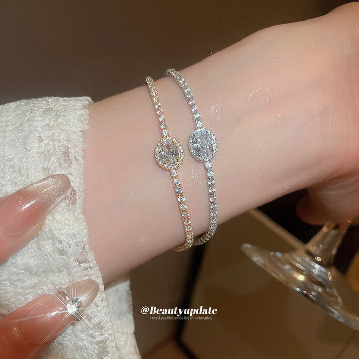 Oval Crystal Center Tennis Bracelet In Gold Or Silver Tone
