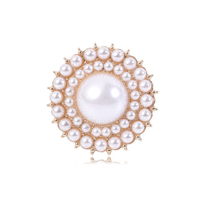 Front product view of the round medallion arranged in concentric rows of pearl-like beads brooch