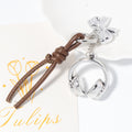 Silver Headphones Keychain Brown Leather Cord Bow Charm view 2