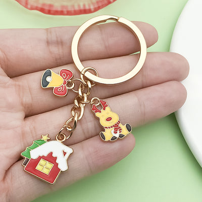 Image 1 showing a hand holding two different shaped key chains.