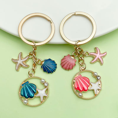 Image 1 showing a pair of seas and starfish charms.