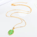 Gold Tone Green Monstera Leaf Necklace and Huggie Earring Options view 4