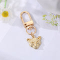 Gold and Silver Tone Assorted Symbol and Character Clip Keychains view 10