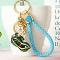 Red and Green Enamel Peanut Keychains with Floral Accents view 3