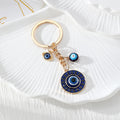 Gold Tone Round Rhinestone Evil Eye Keychains in Four Colors view 5