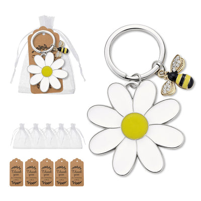A daisy and bee keychain is shown beside a white organza bag and printed thank-you tags.