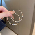 Round Hoop Earrings in Assorted Textures and Sizes view 3