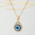 Gold Tone Crystal Teardrop Evil Eye Pendant Necklace with Fine Chain view 1