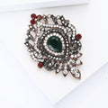 Vintage Oval Brooch with Green Center and Red Crystal Accents view 3