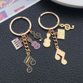 Purple Black Red Blue Pink and Yellow Music Keychains view 3