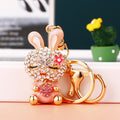 Jeweled Strawberry Holding Rabbit Keychains in Four Pictured Colors view 2