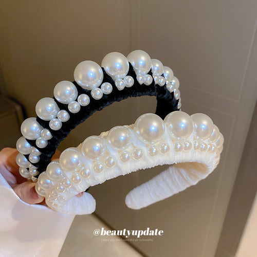 padded velvet headband with graduated pearl-like beads shown in the first close product view