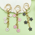 Gold-Tone Initial Letter Keychain With Three Flower Charms view 1