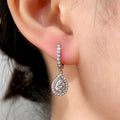 Silver Teardrop Halo Dangle Earrings In A Polished Decorative Design view 4