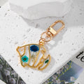 Gold Tone Butterfly and Fishtail Pressed Flower Clip Keychains view 2