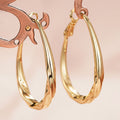 Brass Gold-Tone Twisted Teardrop Hoop Earrings in Three Sizes view 1