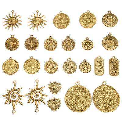 Gold-tone sun charms arranged on a light background