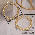 Gold Tone Large Faceted Hammered Texture Hoop Earrings view 4
