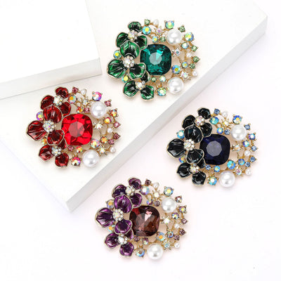 Product display showing two overlapping crystal flowers with pearls and multicolor accents