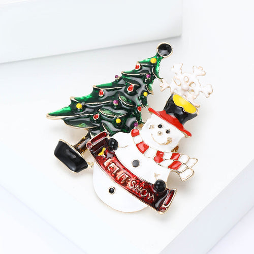 Angled snowman holiday brooch green tree red scarf on white block