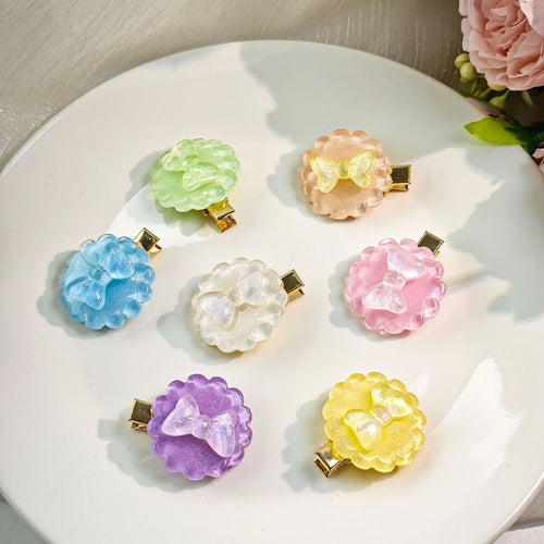 Second supplied view of colorful bow and star hair clips