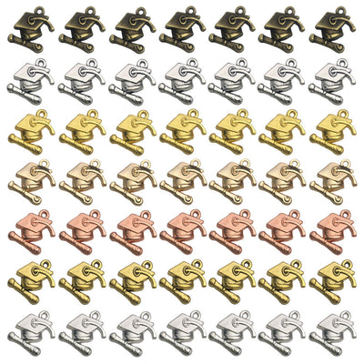 Gold-tone assorted shape charms arranged on a light background