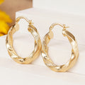 Faceted Twist Hoop Earrings in Gold-Tone Metal Jewelry view 3