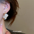 White Flower Cluster Hoop Earrings in Polished Gold Tone view 3
