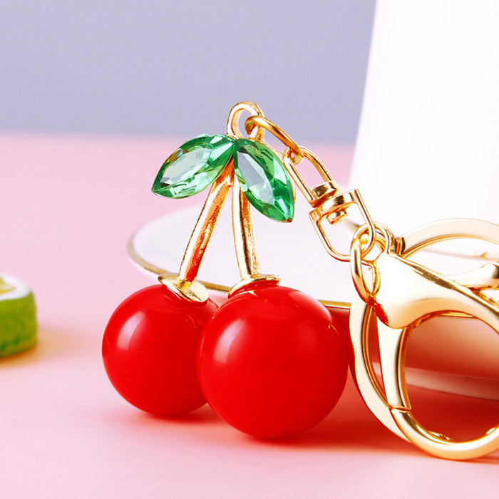 Red Double Cherry Keychain with Green Crystal Leaves and Gold Tone Ring