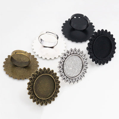 Floral Edge Round Ring Bezel Settings in Three Finishes assortment on a plain background