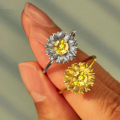 Gold and silver sunflower yellow stone rings worn stacked on fingers