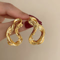 Chunky Twisted Open Hoop Earrings in Gold and Silver Tone view 7