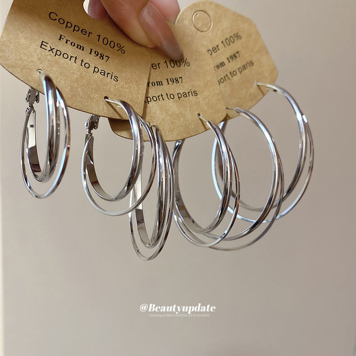 Polished Double Hoop Earrings In Gold And Three Silver Sizes