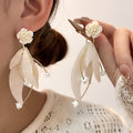White Rose and Translucent Petal Cascade Stud Earrings view 1