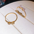 Small Crystal Bow Hoop Earrings in Gold and Silver Tone view 7