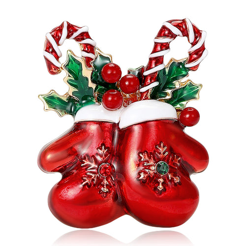 Front view of red enamel mittens topped with candy canes holly and berries