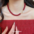Glossy Red Beaded Necklace with Gold Tone Clasp Fashion Jewelry view 1