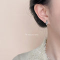 Silver Textured Snake Stud Earrings Green Stone Eyes view 2