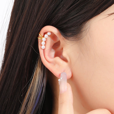 Primary supplied view of gold-tone bow pearl-look curved ear cuff