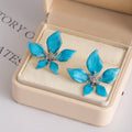 Four Blue Petal Shape Clear Center Flower Stud Earrings view 3