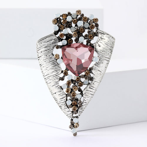 Pink triangular glass leaf brooch silver textured metal front view