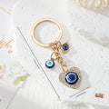 Gold Tone Blue Evil Eye Charm Keychains in Eight Designs view 12