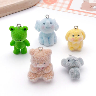 Multicolor dog charms arranged on a light background