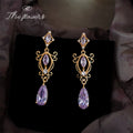 Gold Purple Crystal Long Dangle Earrings Ornate Scroll view 1