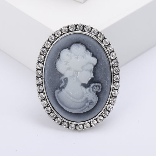 Gold-frame cream cameo lady profile close-up