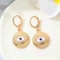 Gold Tone Ornate Evil Eye Medallion Huggie Earrings in Eight Designs view 12