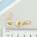 Gold and Silver Tone Textured Eye Medallion Huggie Earrings view 2